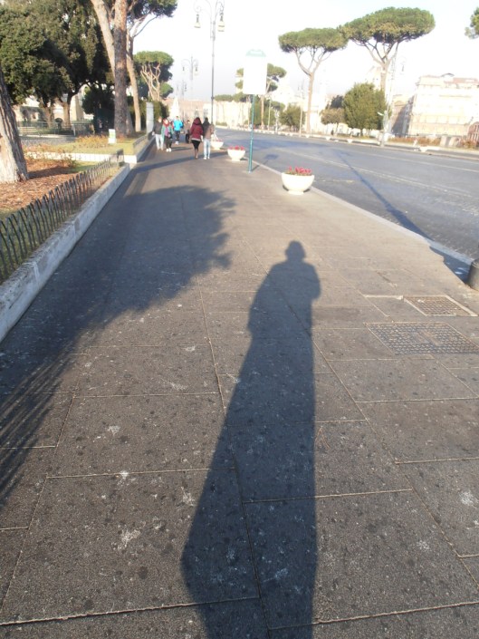 Rome, December 20th 2015. Morning walk in Via dei Fori Imperiali, with the sun behind me.